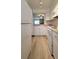 Bright kitchen featuring white cabinets, laminate countertops, and stainless appliances at 10810 Summerset Way, Parker, CO 80138