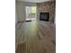 Open-concept living room with sliding glass doors and modern laminate flooring at 10810 Summerset Way, Parker, CO 80138