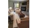 Comfortable living room featuring a stone fireplace and neutral-toned furniture at 10810 Summerset Way, Parker, CO 80138