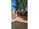 Cozy outdoor patio space with red brick pavers and wood fence, perfect for relaxing or entertaining guests at 10810 Summerset Way, Parker, CO 80138