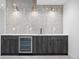 Basement bar area with granite counter, beverage cooler and accent lighting at 2478 S Cherokee St, Denver, CO 80223