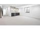 Basement living area with kitchenette bar and modern fixtures at 2478 S Cherokee St, Denver, CO 80223