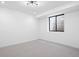 Bedroom with window and plush carpeting at 2478 S Cherokee St, Denver, CO 80223