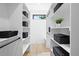 Well-organized walk-in closet with ample shelving and storage space, providing a tidy and functional area at 2478 S Cherokee St, Denver, CO 80223