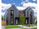 Contemporary duplex featuring a modern facade, manicured lawn, and professionally landscaped front yard at 2478 S Cherokee St, Denver, CO 80223