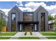 Symmetrical modern duplex with striking architectural details, stylish landscaping, and a welcoming entrance at 2478 S Cherokee St, Denver, CO 80223
