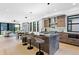 Modern kitchen featuring a large island with seating, stainless steel appliances, and contemporary finishes at 2478 S Cherokee St, Denver, CO 80223