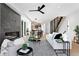 Spacious living room featuring a fireplace, modern staircase, and open floor plan at 2478 S Cherokee St, Denver, CO 80223