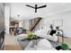 Bright living room with modern staircase, open kitchen, and contemporary furnishings at 2478 S Cherokee St, Denver, CO 80223