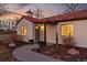 Charming home with a red tiled roof, warm lighting, and welcoming front entryway at 796 Ivanhoe St, Denver, CO 80220