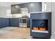 Kitchen showcasing gray cabinets, stainless steel appliances, wood floors, and a built-in pet feeding station at 796 Ivanhoe St, Denver, CO 80220