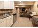 Convenient basement wet bar with sink and mini-fridge at 4236 Lark Sparrow St, Highlands Ranch, CO 80126