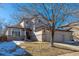 Two-story house with a two-car garage and landscaping at 4236 Lark Sparrow St, Highlands Ranch, CO 80126