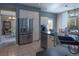 Modern kitchen with stainless steel refrigerator and island at 4236 Lark Sparrow St, Highlands Ranch, CO 80126