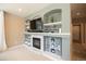 Living room with a fireplace and built-in shelving provides ample storage and entertainment space at 4236 Lark Sparrow St, Highlands Ranch, CO 80126