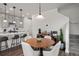 Kitchen dining area with wood table and comfortable seating at 3061 Low Meadow Blvd, Castle Rock, CO 80109