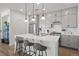 Modern kitchen with gray cabinets, white quartz island, and stainless steel appliances at 3061 Low Meadow Blvd, Castle Rock, CO 80109