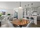 Open concept kitchen and dining area with modern appliances and island at 3061 Low Meadow Blvd, Castle Rock, CO 80109