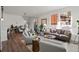 Spacious living room with leather sofa and ample natural light at 3061 Low Meadow Blvd, Castle Rock, CO 80109