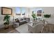 Living room with large windows and cozy seating area at 3061 Low Meadow Blvd, Castle Rock, CO 80109