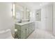 Elegant bathroom with double vanity, large mirrors, and built-in shelving at 3257 S Pontiac St, Denver, CO 80224