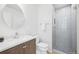 Updated bathroom with walk-in shower and modern vanity at 3257 S Pontiac St, Denver, CO 80224