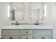 Double vanity with modern fixtures and large mirrors at 3257 S Pontiac St, Denver, CO 80224