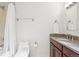 Clean bathroom with shower/tub combo, vanity, and granite countertop at 3257 S Pontiac St, Denver, CO 80224