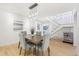 Dining area with wood table, gray chairs, and modern light fixture at 3257 S Pontiac St, Denver, CO 80224