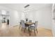 Bright dining room with wood flooring and a view into kitchen at 3257 S Pontiac St, Denver, CO 80224