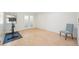 Bright exercise room with hardwood floors and french doors at 3257 S Pontiac St, Denver, CO 80224