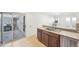 Kitchen features a breakfast bar and access to a private patio at 3257 S Pontiac St, Denver, CO 80224