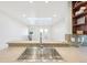 Kitchen features a breakfast bar with a sink and access to exercise room at 3257 S Pontiac St, Denver, CO 80224