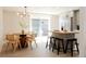 Bright dining area connected to kitchen features modern furnishings and patio access at 1020 Stuart, Denver, CO 80204