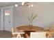 Stylish dining area with modern lighting fixture and bright white walls at 1020 Stuart, Denver, CO 80204