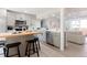 Renovated kitchen featuring a center island, stainless appliances, and a breakfast bar at 1020 Stuart, Denver, CO 80204
