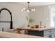 Modern kitchen featuring an island, white brick, and modern lighting at 1020 Stuart, Denver, CO 80204