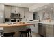 Modern kitchen showcasing bar seating, countertops, stainless steel appliances, and open layout at 1020 Stuart, Denver, CO 80204