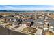 Stunning aerial view of a residential neighborhood with mountain views in the distance at 1015 Auburn Dr, Erie, CO 80516