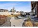 An inviting backyard featuring a dining area, patio, and a landscaped yard, ideal for outdoor living and entertainment at 1015 Auburn Dr, Erie, CO 80516