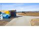 Community baseball field with walking path, dugout, bleachers, and mountain views at 1015 Auburn Dr, Erie, CO 80516