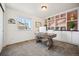 Bright home office featuring custom built-ins, modern desk, and large window letting in natural light at 1015 Auburn Dr, Erie, CO 80516
