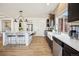 Modern kitchen with stainless steel appliances, white countertops, and stylish finishes at 1015 Auburn Dr, Erie, CO 80516