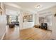 Open living room area with hardwood floors, decorative lattice accent wall, and lots of natural light at 1015 Auburn Dr, Erie, CO 80516