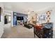 Inviting living room with comfortable seating, a modern ceiling fan, and stylish decor throughout at 1015 Auburn Dr, Erie, CO 80516