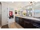 Bright bathroom featuring dual sinks, large mirror, vanity and shower with lots of natural light at 1015 Auburn Dr, Erie, CO 80516