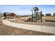 Community playground area featuring a playground, swing set, picnic shelter, and pathway at 1015 Auburn Dr, Erie, CO 80516