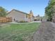 Large backyard with a well-maintained lawn, storage shed, and a patio for outdoor entertaining at 4063 S Cathay Ct, Aurora, CO 80013
