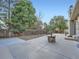 Spacious backyard with a concrete patio and a fire pit, ideal for relaxing and entertaining guests at 4063 S Cathay Ct, Aurora, CO 80013