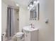 This bathroom features a shower with stylish curtain, a new vanity, and modern lighting at 4063 S Cathay Ct, Aurora, CO 80013